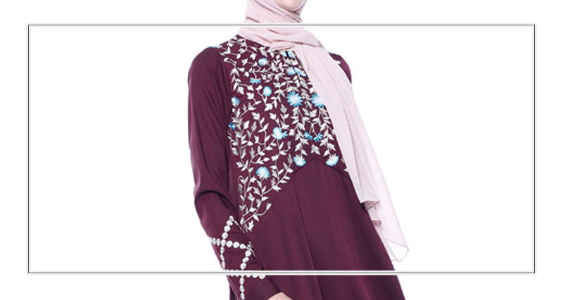 An everyday minority of ladies embroiders ABU Dhabi robes