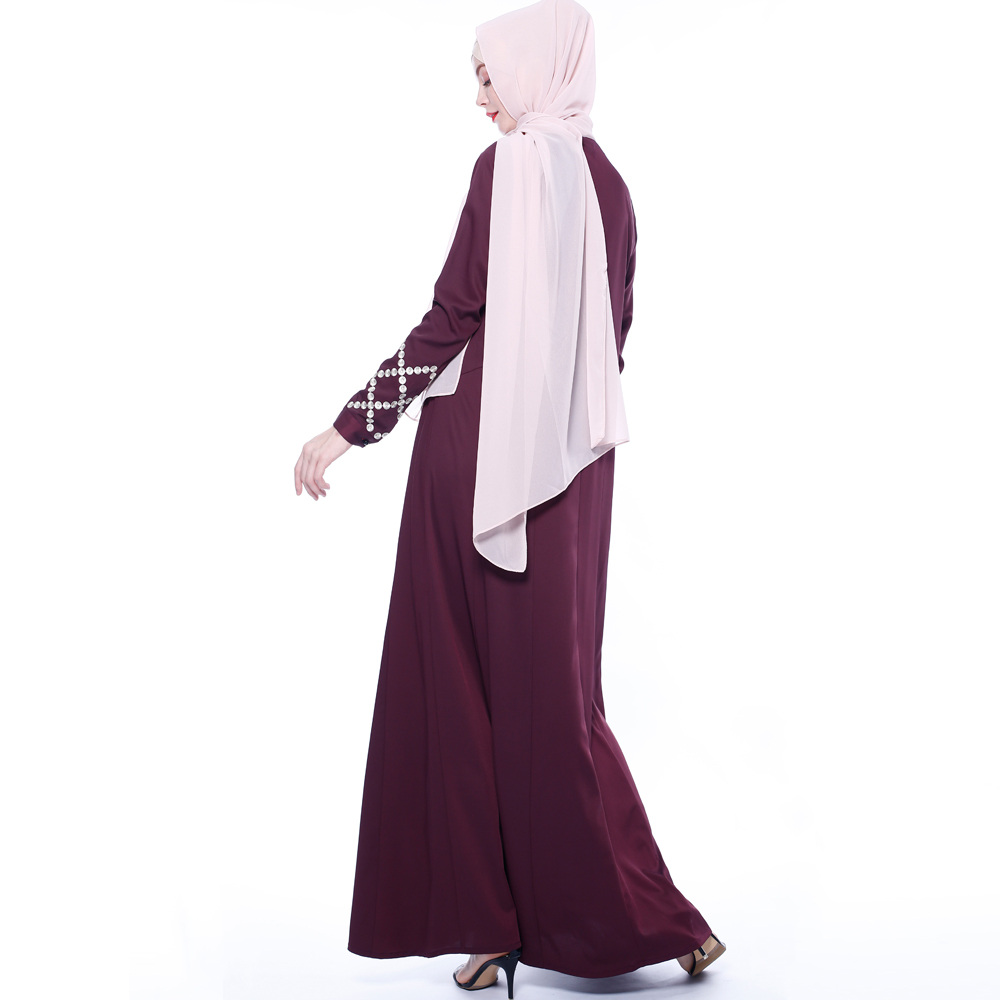 An everyday minority of ladies embroiders ABU Dhabi robes