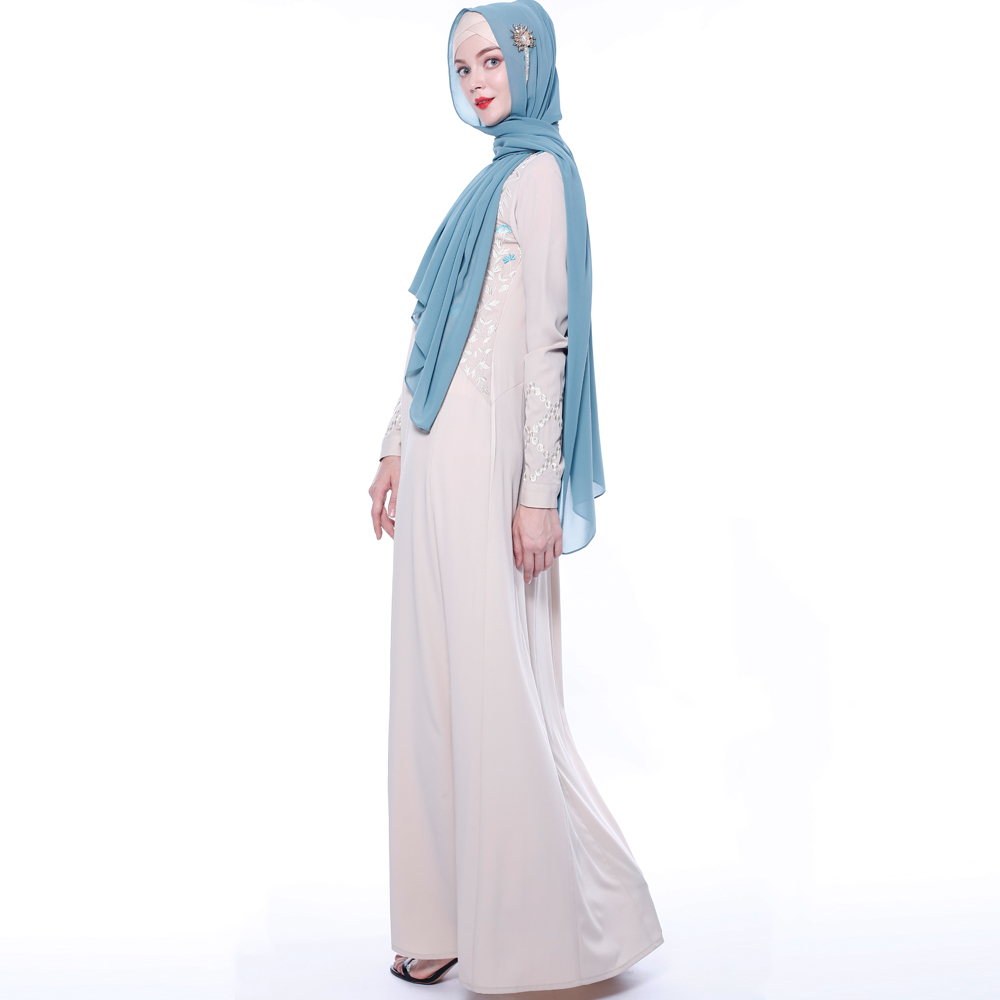 An everyday minority of ladies embroiders ABU Dhabi robes