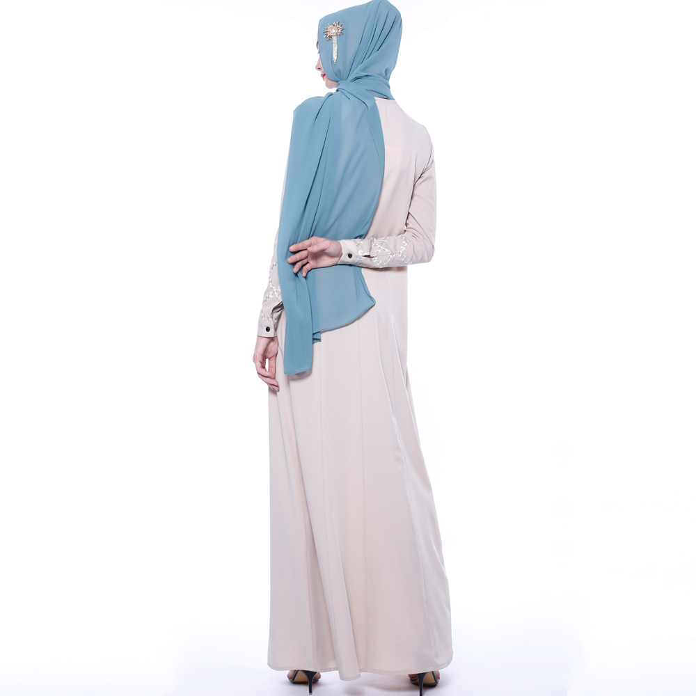 An everyday minority of ladies embroiders ABU Dhabi robes