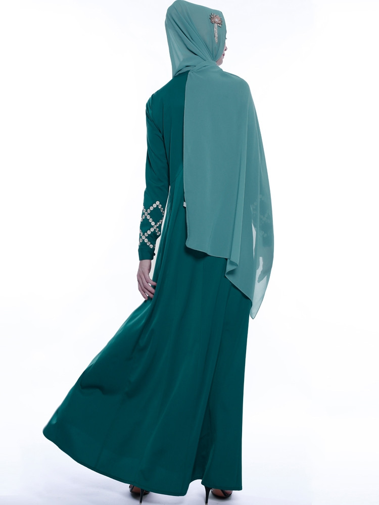 An everyday minority of ladies embroiders ABU Dhabi robes