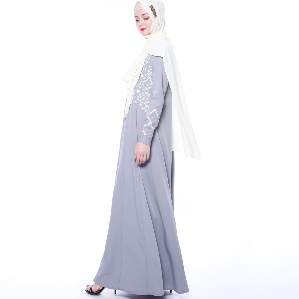 An everyday minority of ladies embroiders ABU Dhabi robes