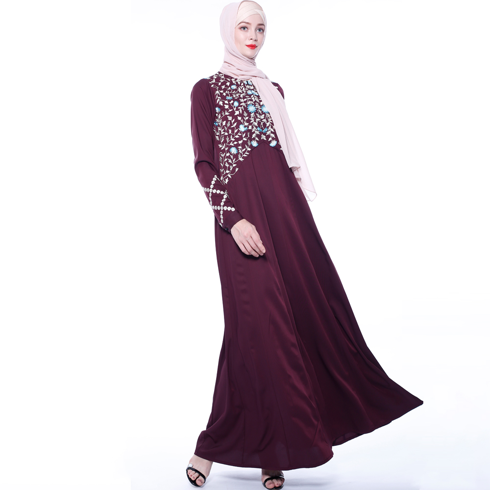 An everyday minority of ladies embroiders ABU Dhabi robes