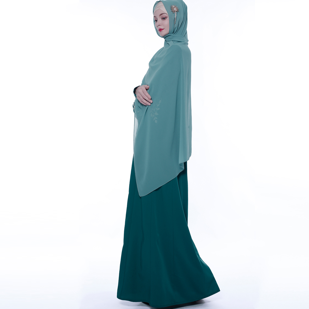 An everyday minority of ladies embroiders ABU Dhabi robes